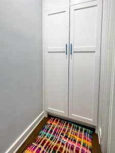 resin diy door pulls on a laundry cabinet