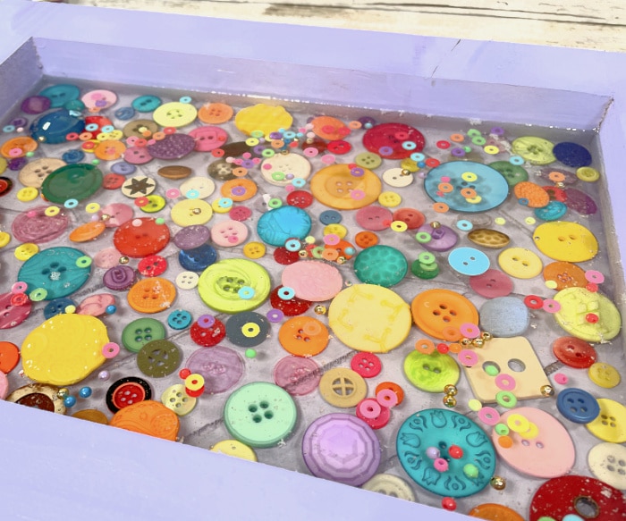 Second Layer Resin in Tray with Buttons
