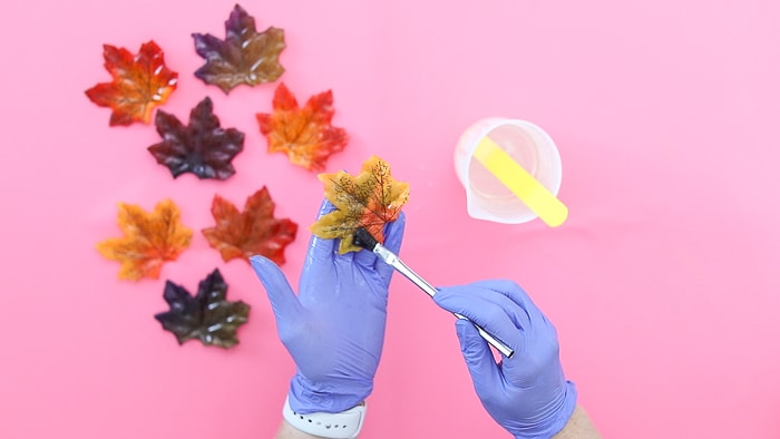painting resin onto leaves