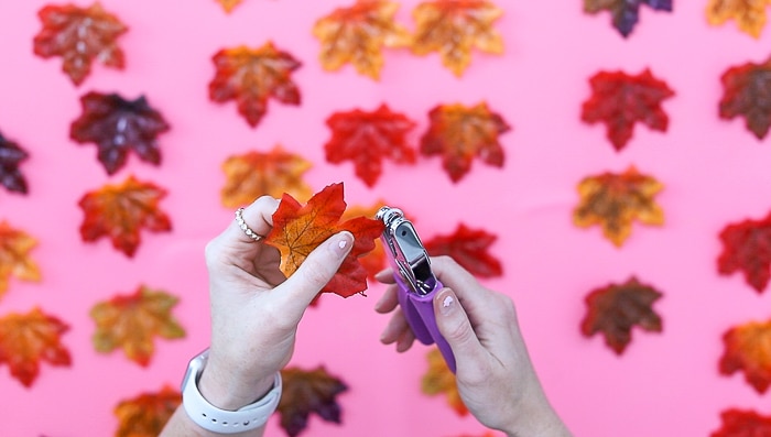 cutting holes to create a resin leaves wall hanging