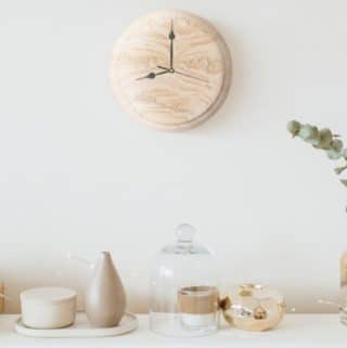 resin-wall-clock-on-a-wall-surrounded-by-decor