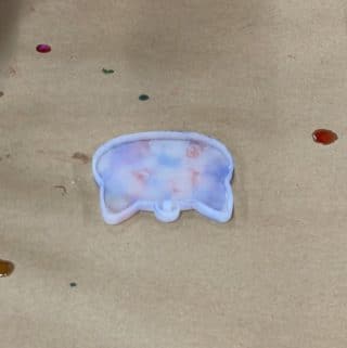 A-cat-face-mold-to-be-used-for-a-resin-magnet