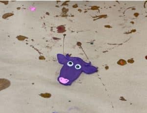 Custom magnet of a purple cow.