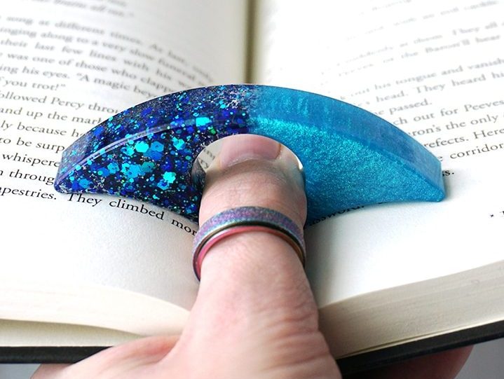Resin Book Page Holder with thumb in book